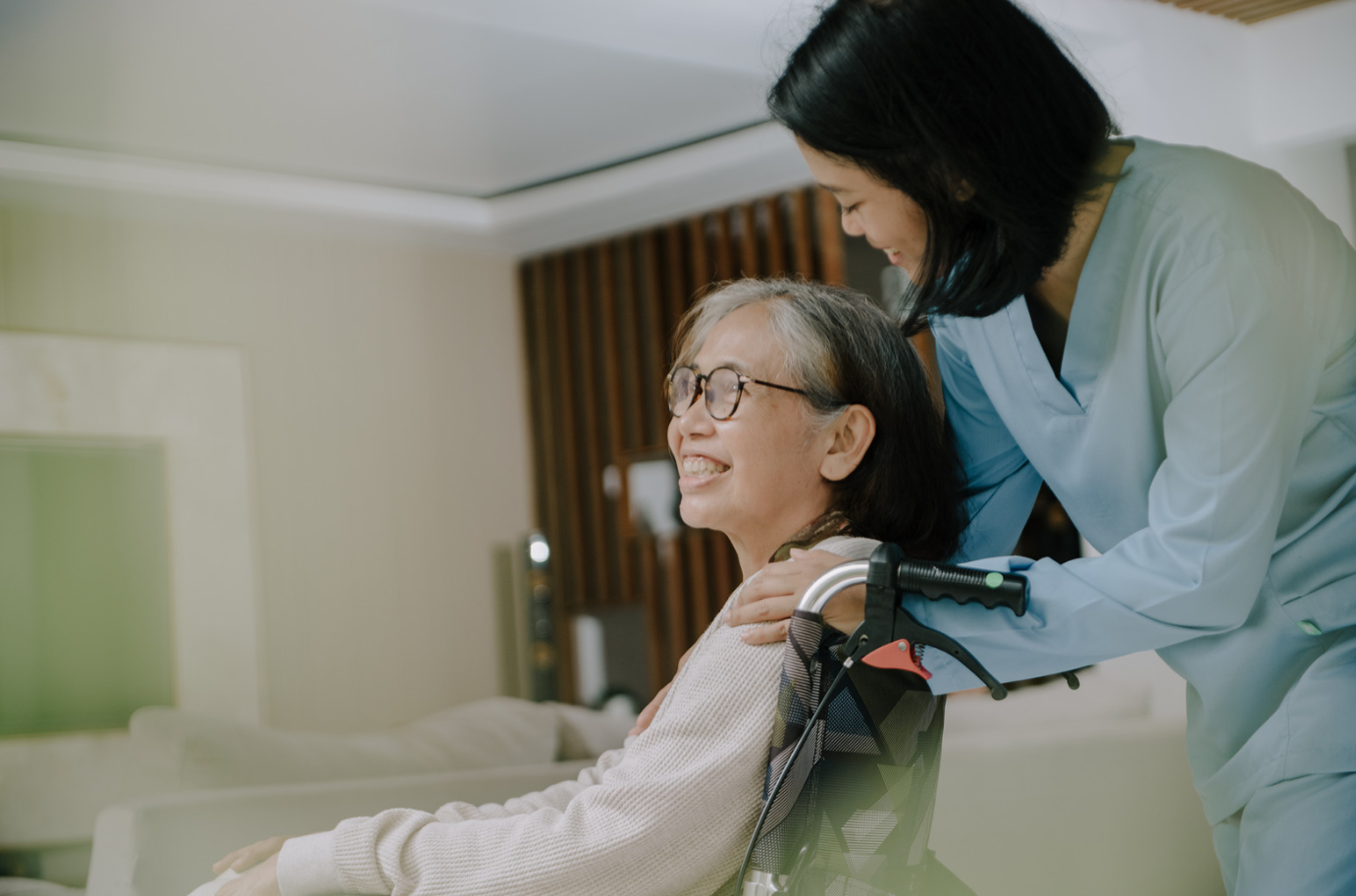 Caregiver helping client in wheelchair